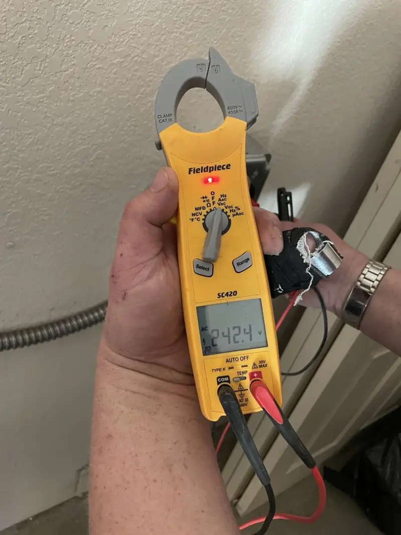 Voltage testing with clamp meter during Recessed Lighting Installation in Berea
